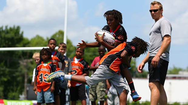 Using Rugby to Learn to Tackle Safely in Football